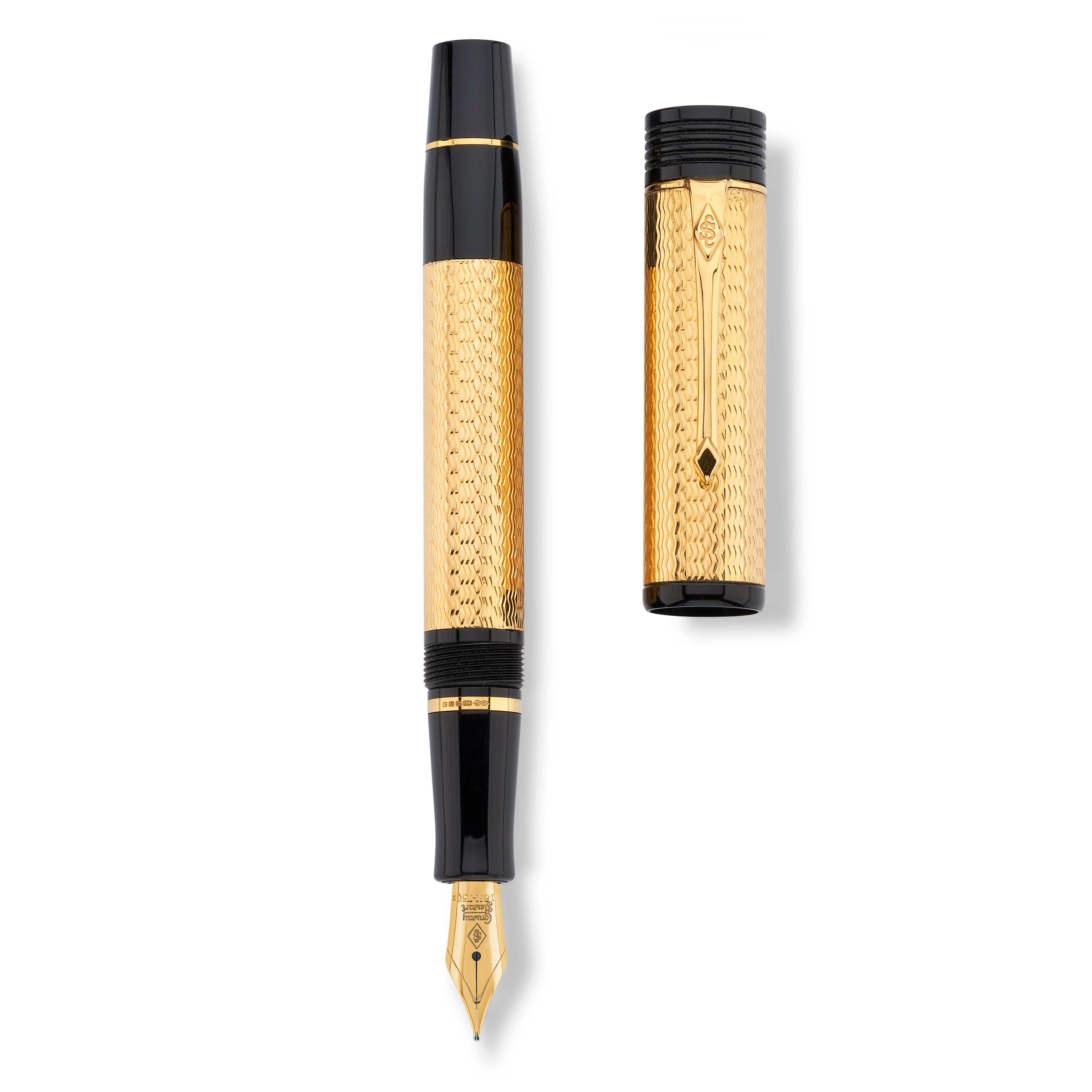 Conway Stewart Churchill Vermeil fountain pen and cap laid side by side, showing gold filigree pattern