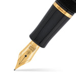 Close-up of the gold nib and black grip section on the Conway Stewart Churchill Vermeil fountain pen