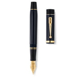 Conway Stewart Churchill Midnight Blue fountain pen and cap laid side by side, viewed from above