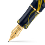 Nib close-up on the Wellington Givita pen, gold nib and navy-and-yellow swirl barrel