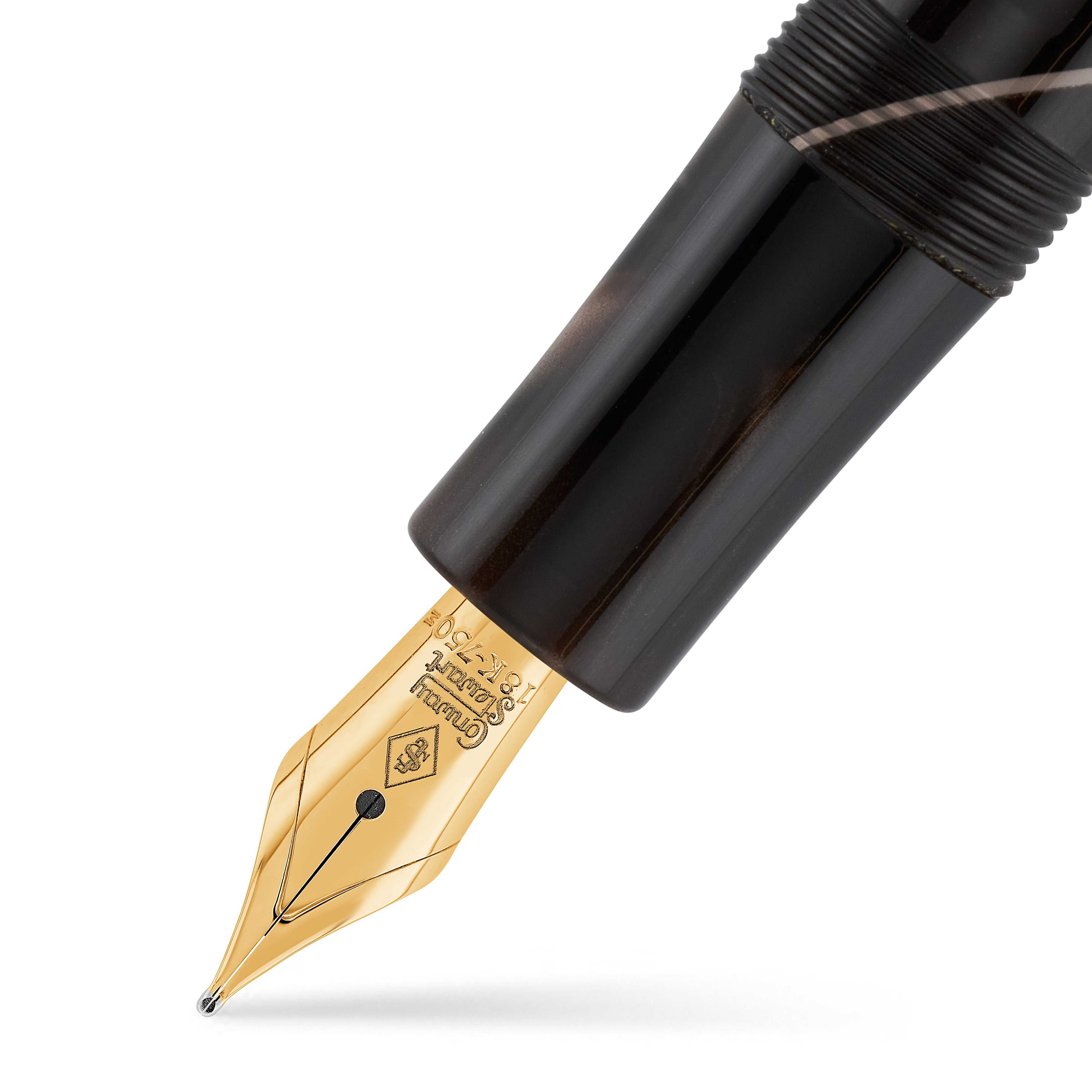 Close-up of the gold nib engraved with the Conway Stewart crest, mocha swirled grip above