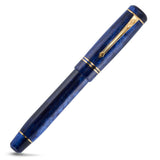 Winston Blue Stardust pen at a mirrored angle, showing the blue stardust marbling in full