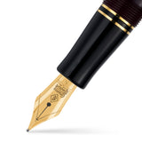 Close-up of the fountain pen's gold nib engraved with the Conway Stewart crest