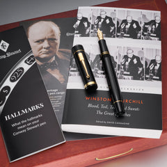 Churchill Heritage THEIR FINEST HOUR fountain pen resting on a Churchill speeches book beside a hallmarks leaflet
