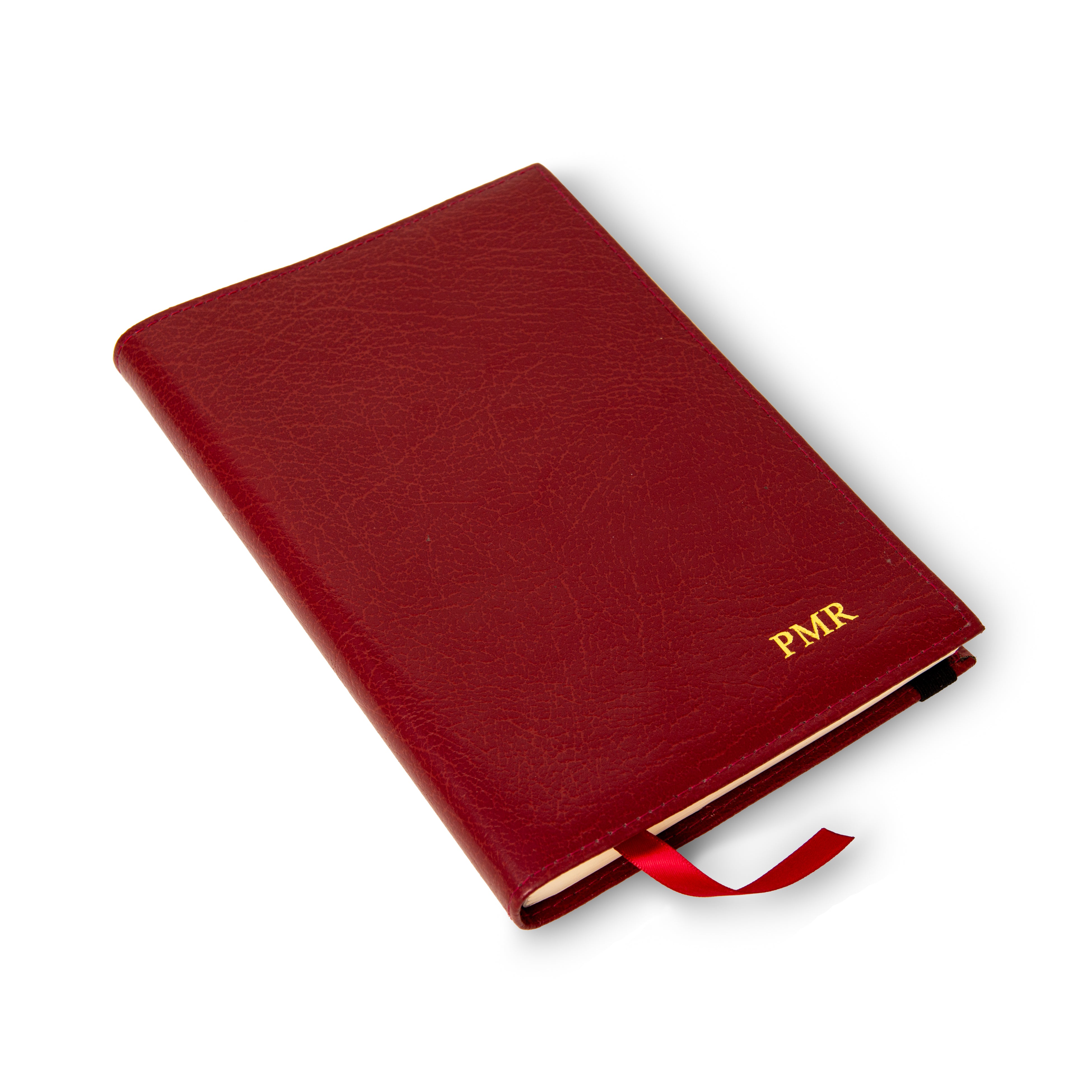 Burgundy leather luxury notebook personalised with gold PMR initials and a red ribbon marker