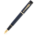 Capped Churchill Blue Chased fountain pen shown diagonally, navy engine-turned texture with gold trim
