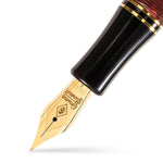 Close-up of the gold nib engraved Conway Stewart on the Churchill Burgundy fountain pen