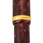 Close-up of the gold cap band showing hallmark stamps on the Churchill Burgundy pen