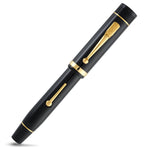 Churchill Classic Black Lever-Fill pen fully capped, straight diagonal view of the black barrel and gold lever