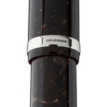 Close-up of Churchill Dartmoor Silver cap band hallmark stamps reading CS 925 on tortoiseshell acrylic