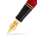 Close-up of Churchill Modena Red nib in gold tone against black and red lacquer section