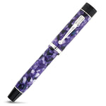 Churchill Wisteria fountain pen capped, shown from a slightly rotated angle showing the purple marbling
