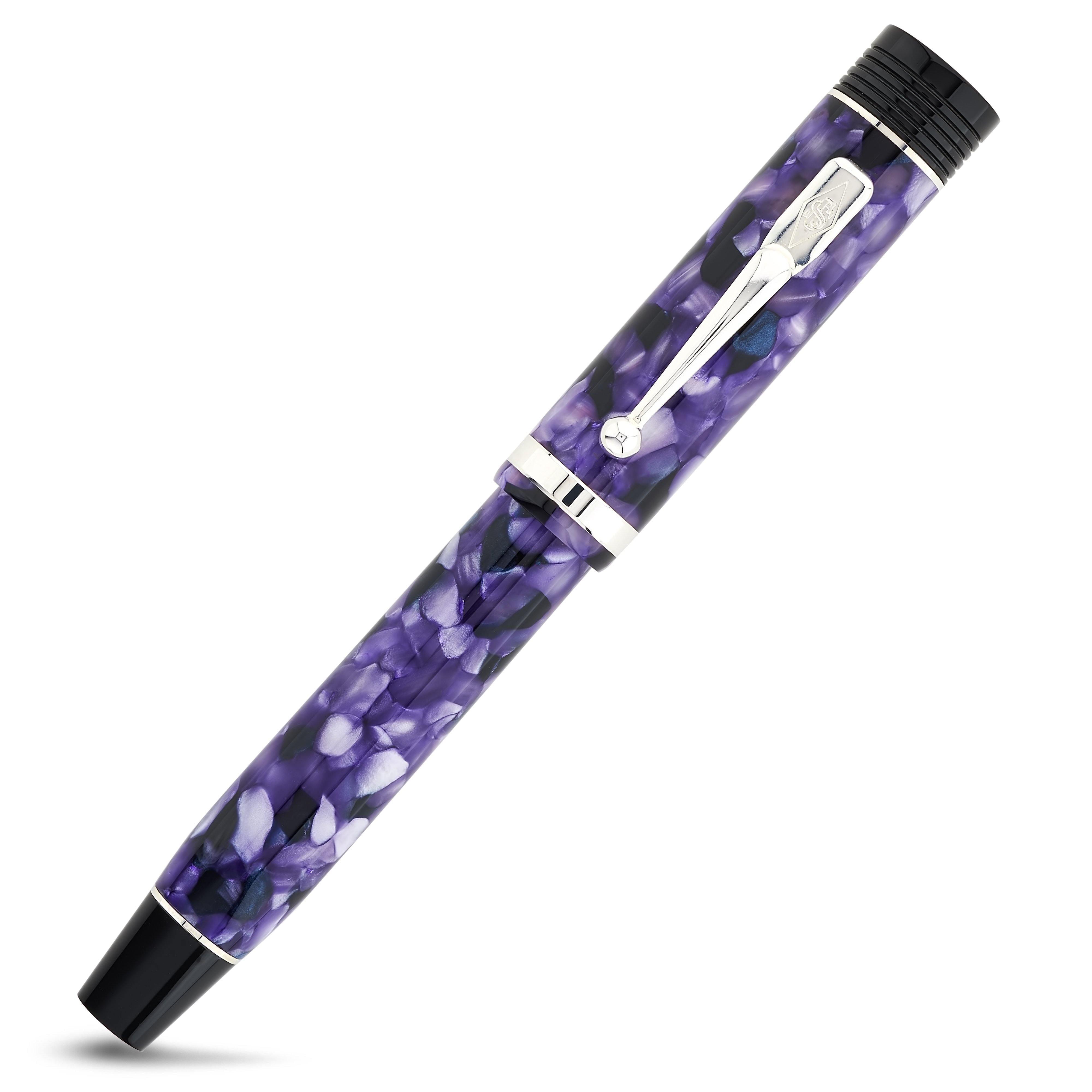 Churchill Wisteria fountain pen capped, shown from a slightly rotated angle showing the purple marbling