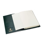 Green leather Conway Stewart notebook open, showing the inside card pocket and blank pages