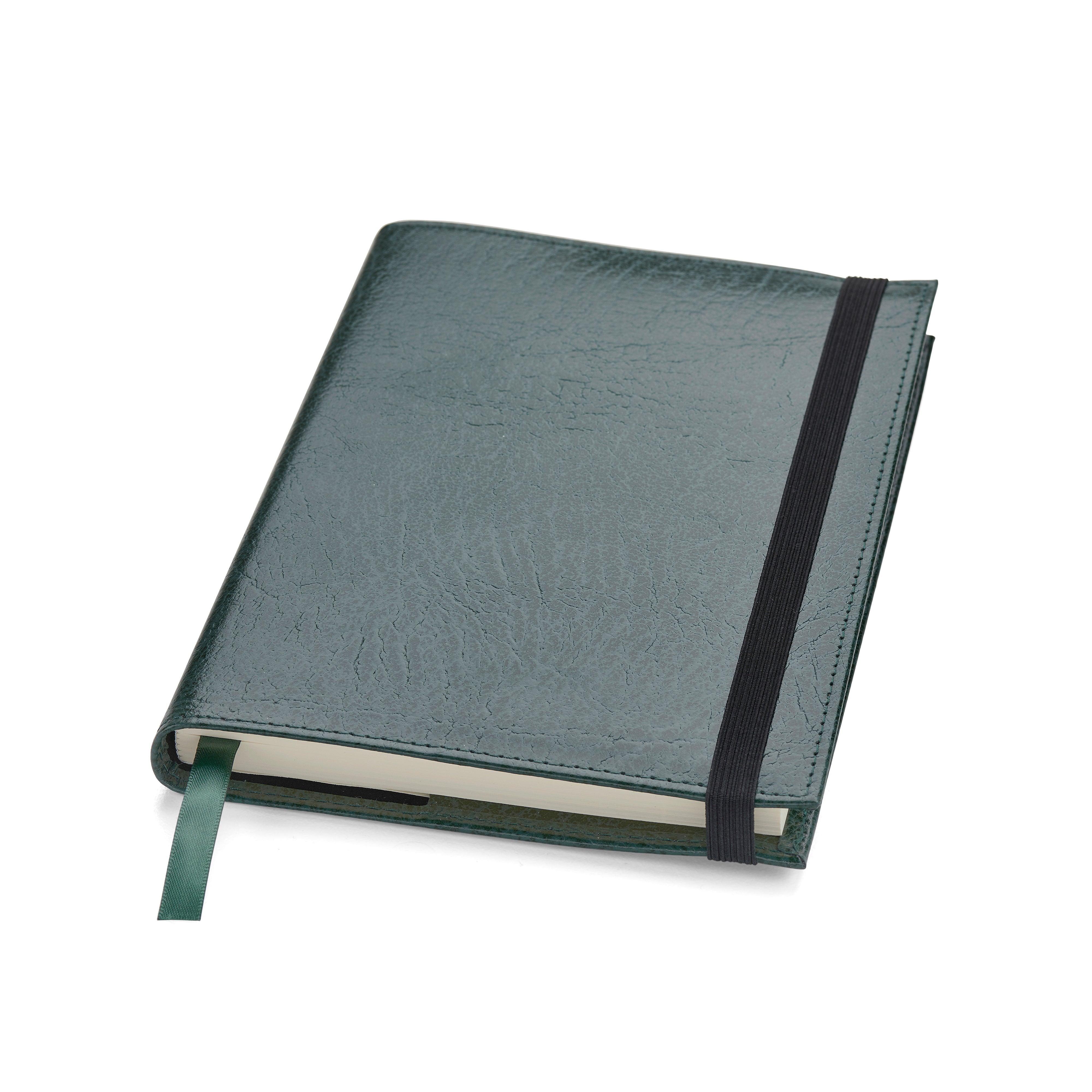 Green leather Conway Stewart notebook closed, angled view showing the elastic strap and ribbon marker