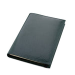 Green leather Conway Stewart notebook closed, angled view of the smooth grained cover