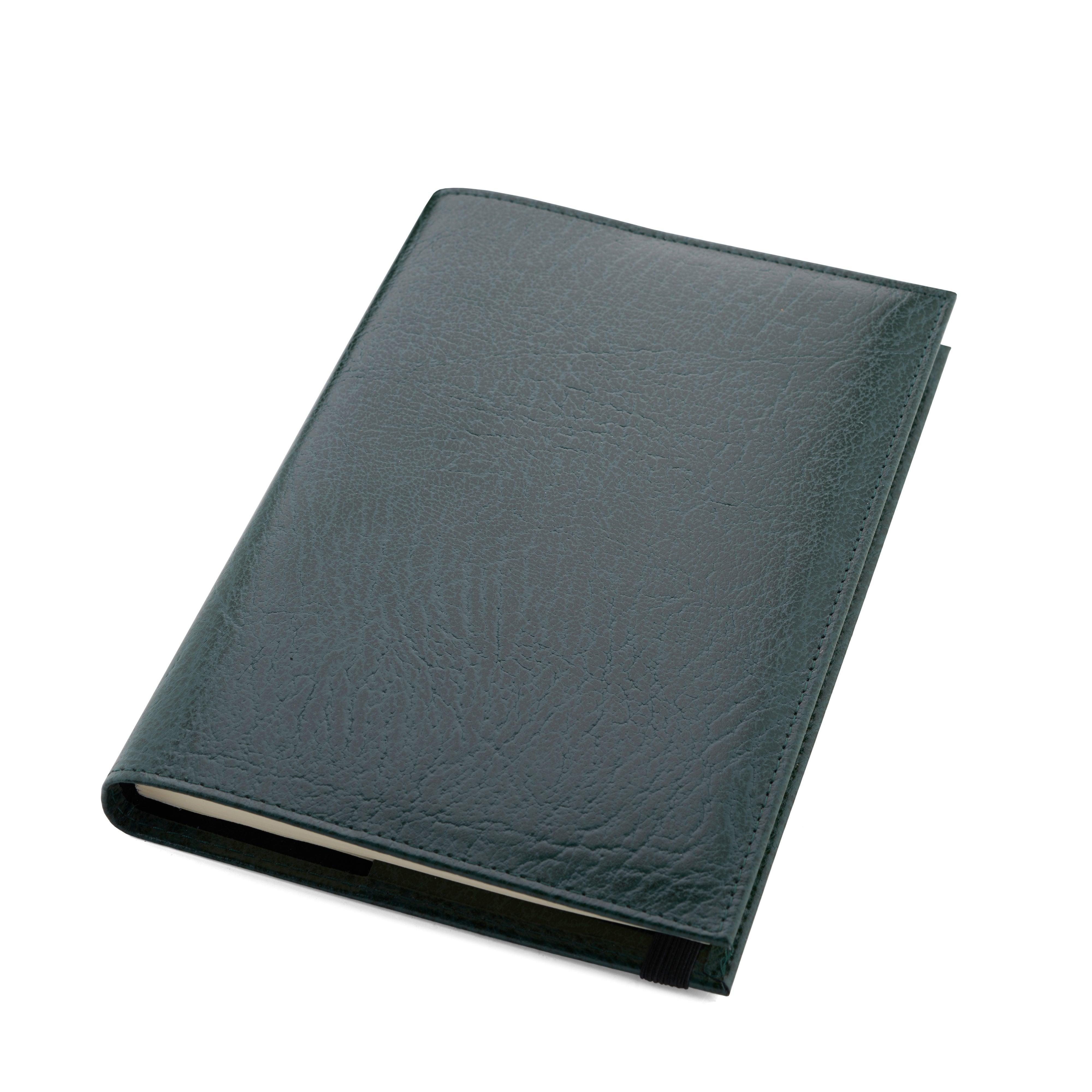 Green leather Conway Stewart notebook closed, angled view of the smooth grained cover