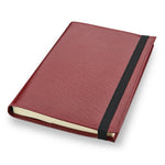 Burgundy leather Conway Stewart notebook closed, angled view showing the elastic strap