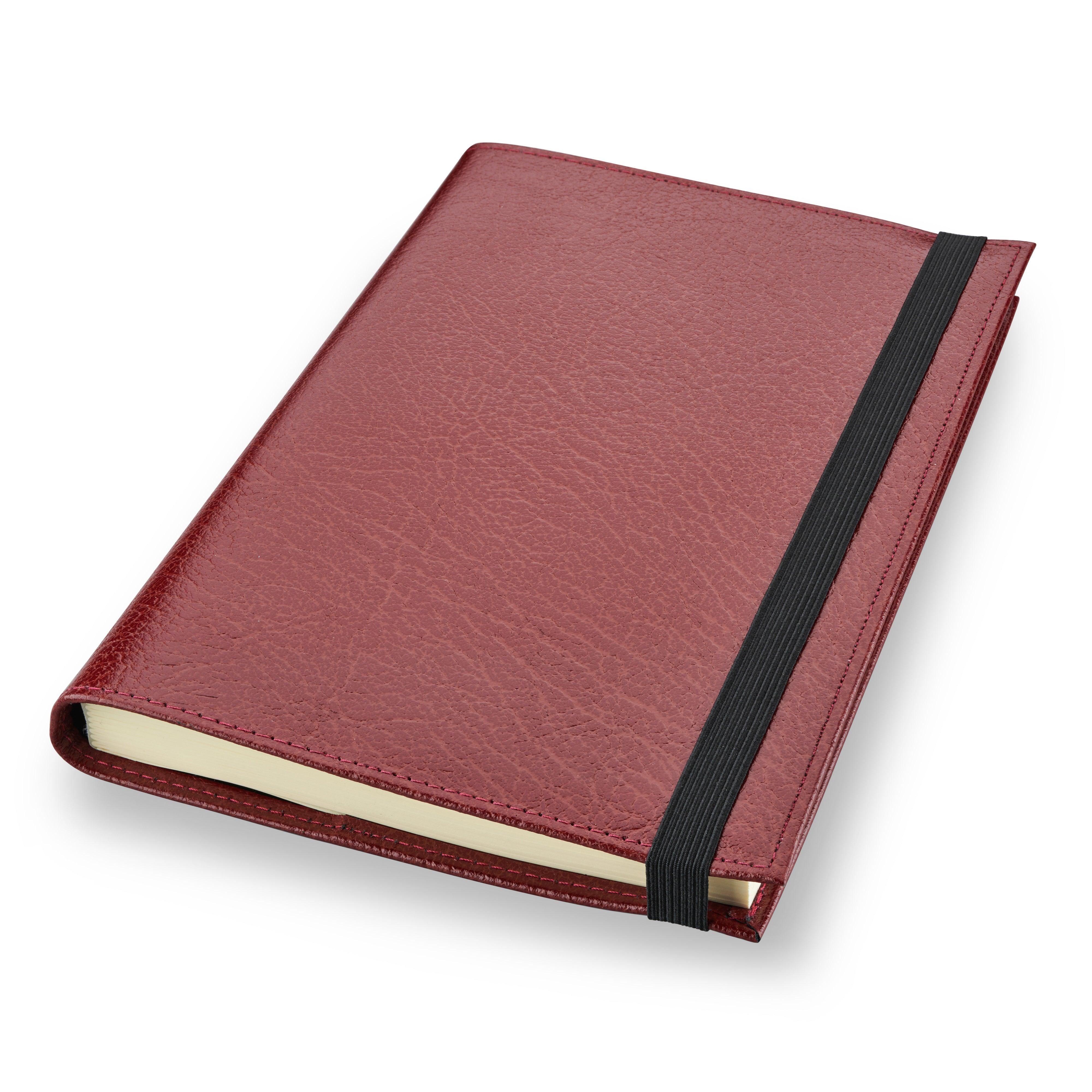 Burgundy leather Conway Stewart notebook closed, angled view showing the elastic strap
