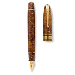 Series 100 Amber fountain pen shown uncapped beside its cap, flat lay view