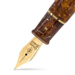 Close-up of the gold nib engraved Conway Stewart on the Series 100 Amber fountain pen