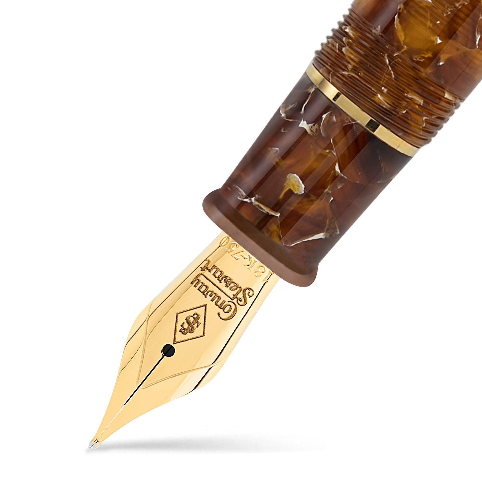 Close-up of the gold nib engraved Conway Stewart on the Series 100 Amber fountain pen