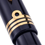 Close-up of Series 100 Commander cap band and ring-mounted clip attachment in gold tone