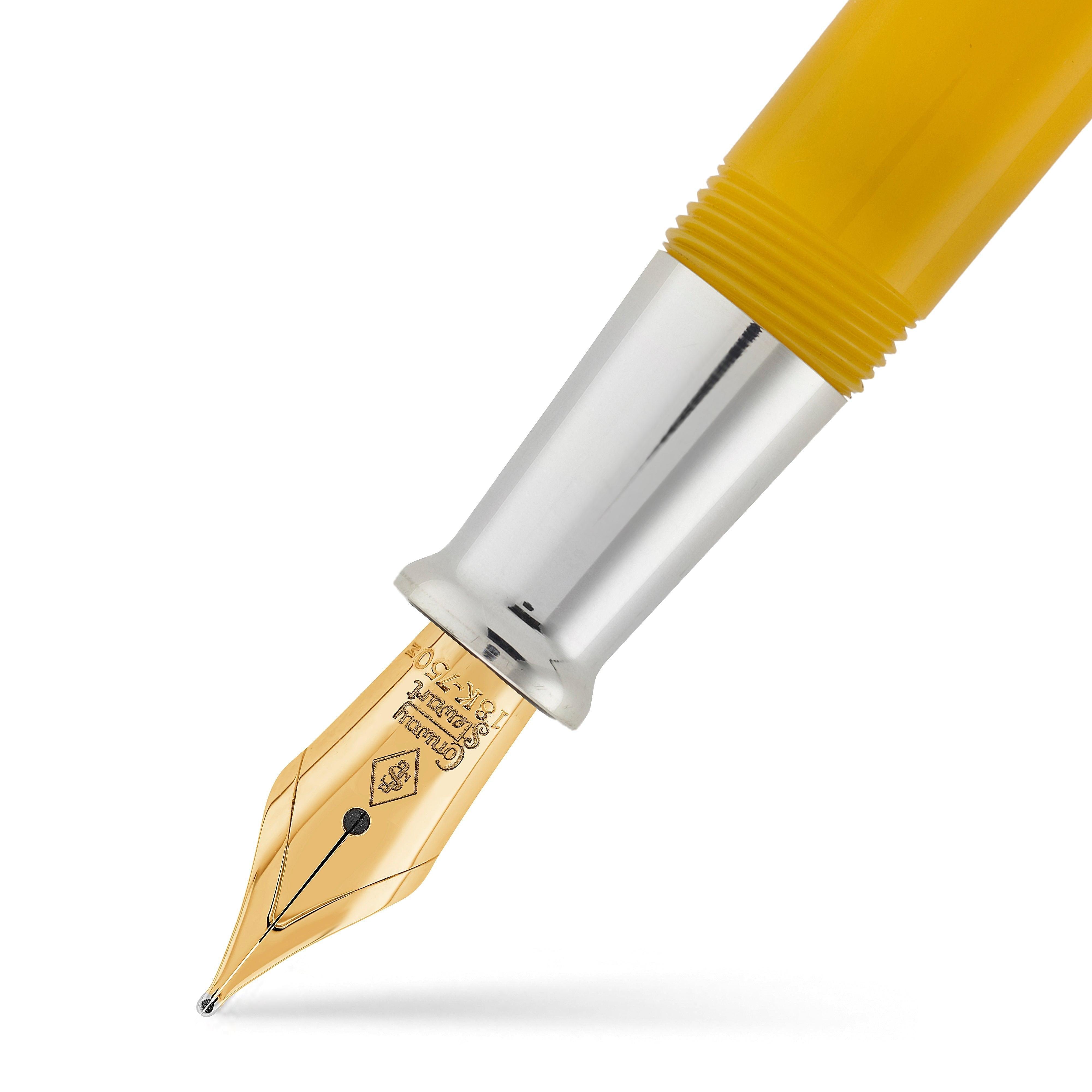 Close-up of a Silvicity Sunrise Yellow nib in gold-tone finish, engraved with the Conway Stewart crest