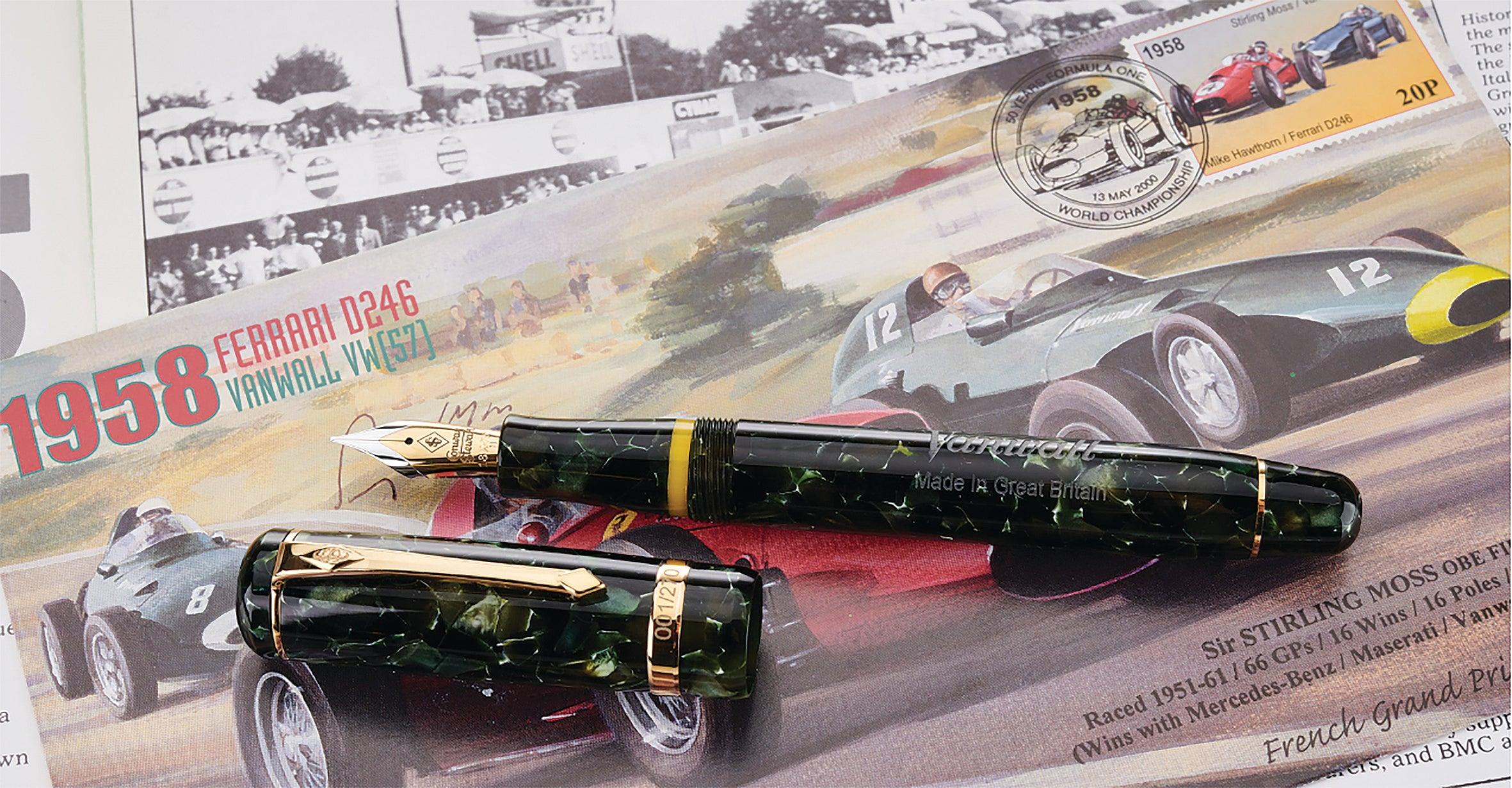 Vanwall Pen in green marbled acrylic, capped and cap detached, resting on illustrated 1958 Vanwall motor racing artwork