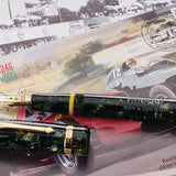 Vanwall Pen in green marbled acrylic, capped and cap detached, resting on illustrated 1958 Vanwall motor racing artwork
