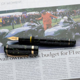 Vanwall fountain pen capped and uncapped on a newspaper article about Vanwall owners