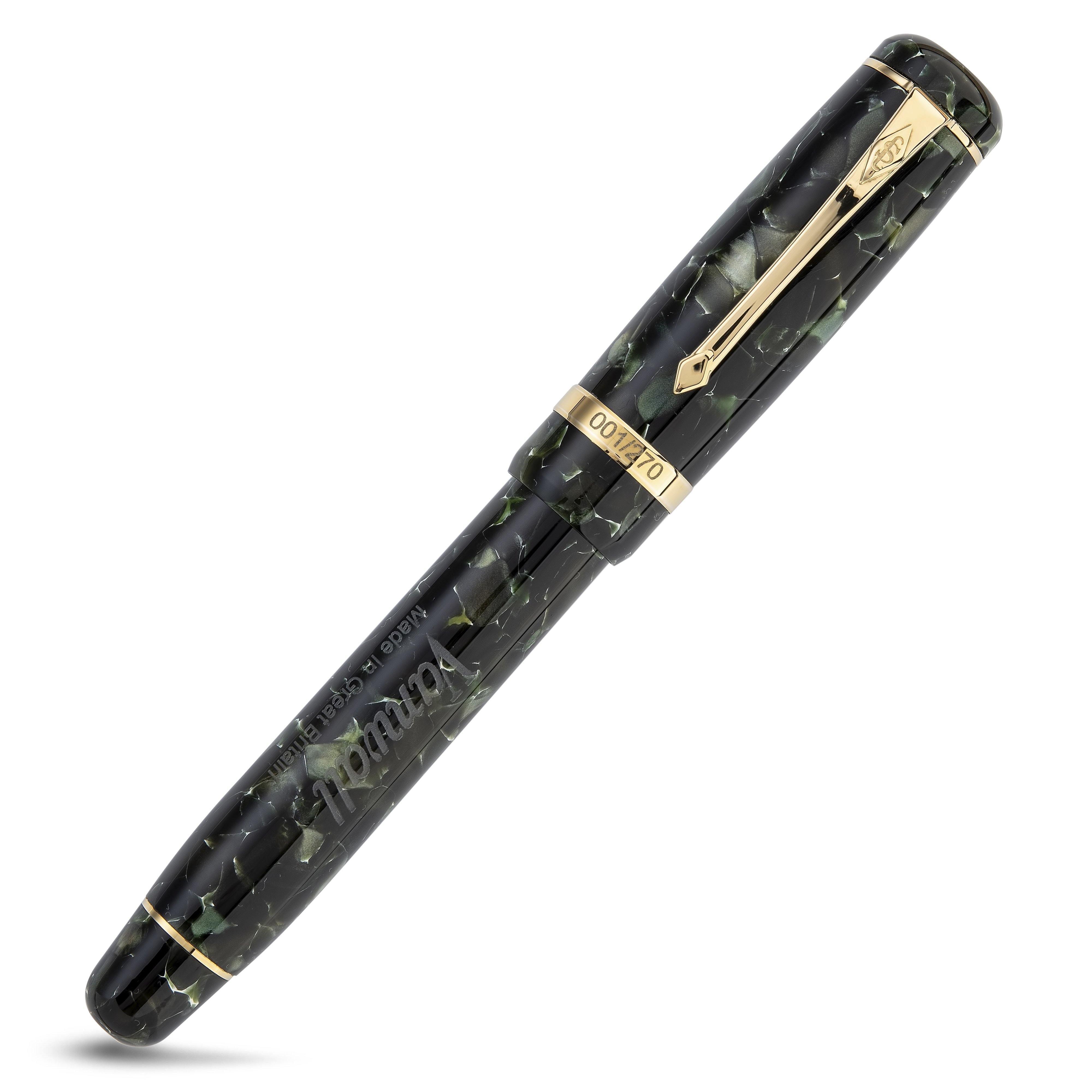 Vanwall fountain pen capped, close diagonal view of the green marbled barrel and gold cap band