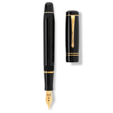 Winston Classic Black Gold fountain pen shown uncapped beside its cap, flat lay view