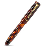Winston Classic Brown fountain pen fully capped, straight diagonal view of the mottled brown barrel and gold clip