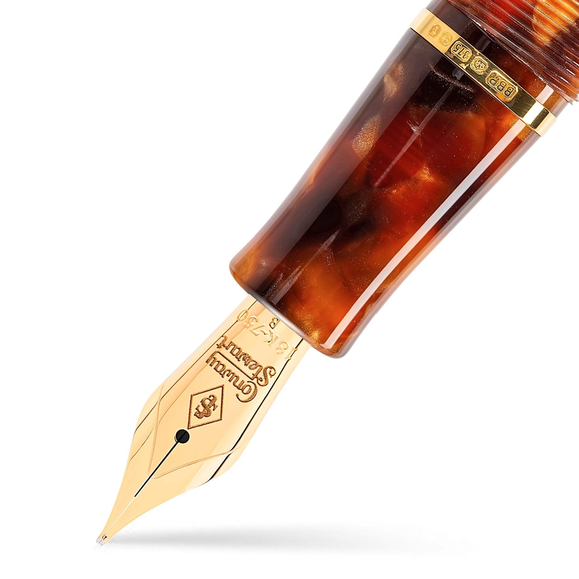 Close-up of the Winston Classic Brown gold nib and hallmarked gold band beneath the tortoiseshell cap