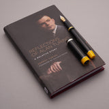 The Alan Turing Pen resting on its companion book, Reflections of Alan Turing: A Relative Story