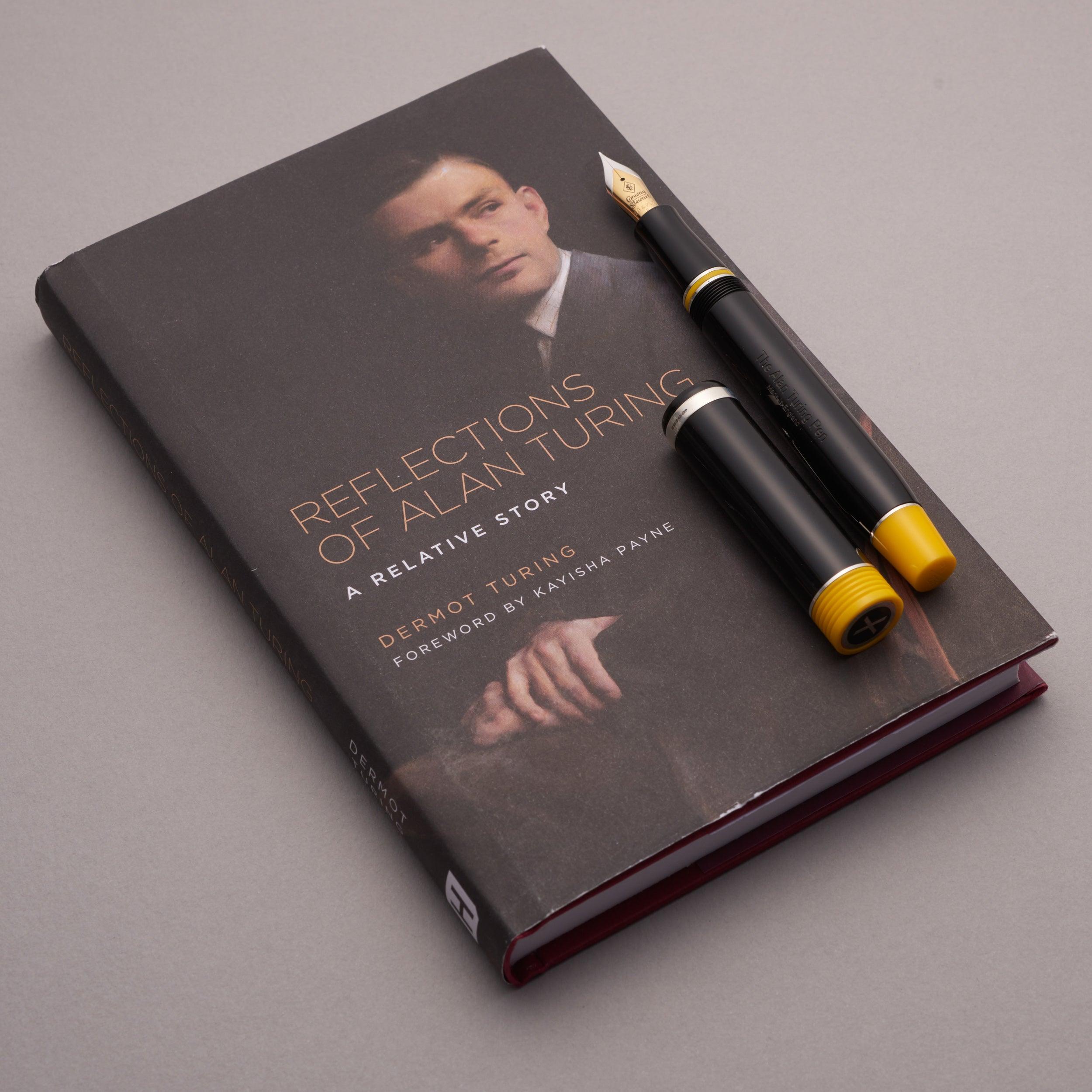 The Alan Turing Pen resting on its companion book, Reflections of Alan Turing: A Relative Story