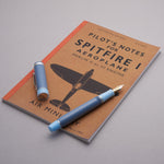 Conway Stewart Spitfire pen and cap laid on a reproduction Spitfire I pilot's notes booklet