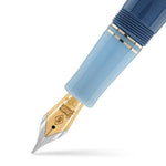 Close-up of the Conway Stewart Spitfire nib, a gold nib below a two-tone blue barrel