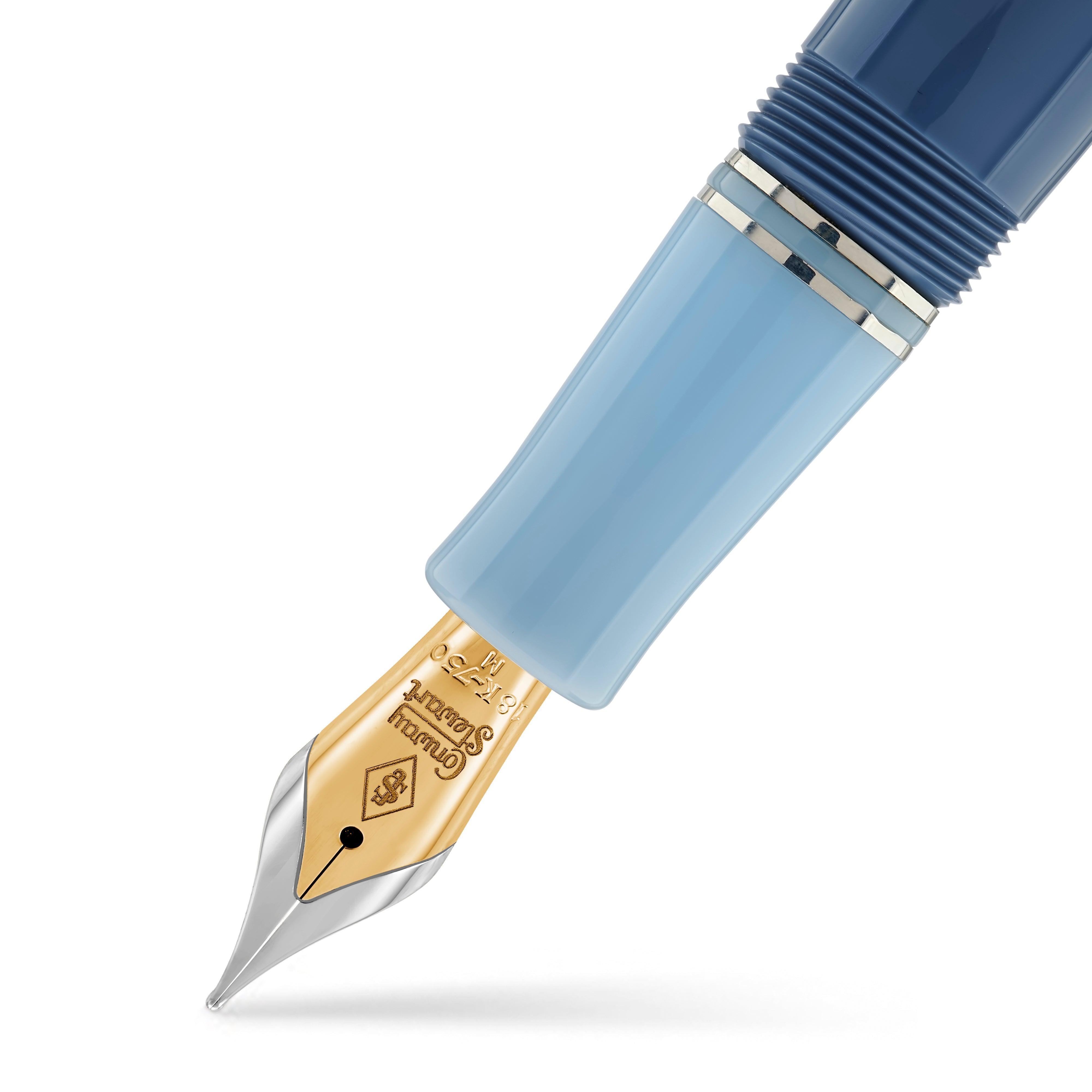 Close-up of the Conway Stewart Spitfire nib, a gold nib below a two-tone blue barrel